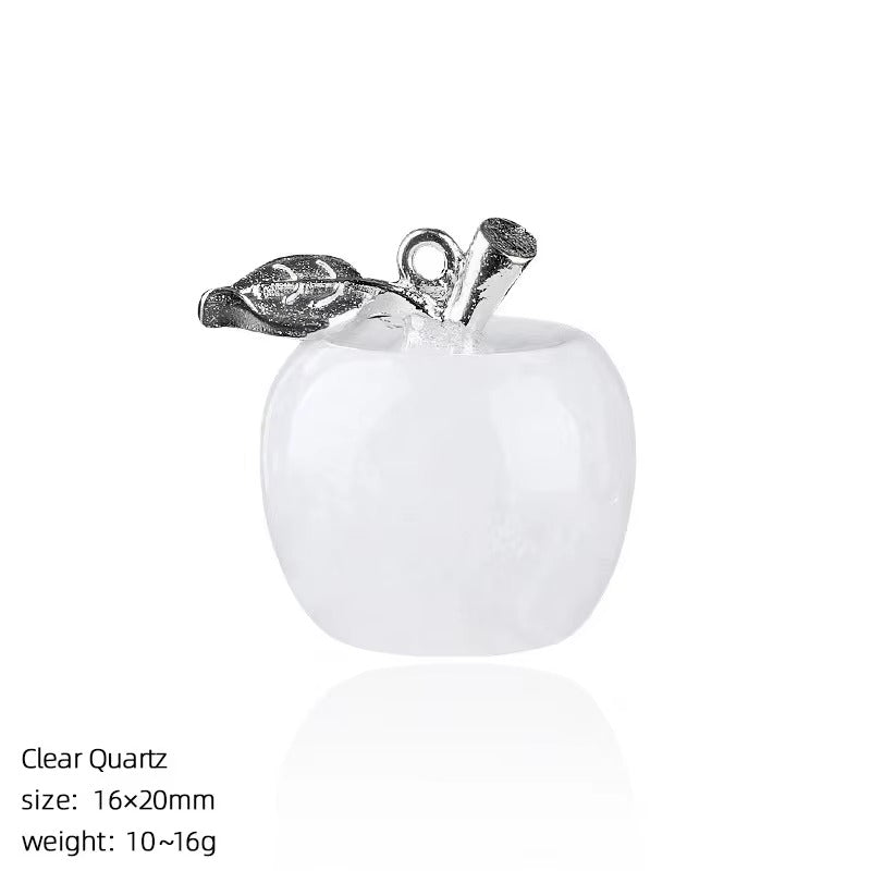 Front view of a 16×20mm clear quartz apple carving with milky-white body and antiqued silver alloy stem and leaf bail, white background.