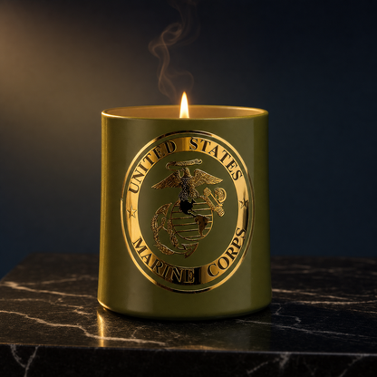 Honor Series USMC Candle — luxury editorial product photograph on dark Marquina marble with warm candlelight