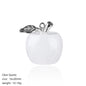Front view of a 16×20mm clear quartz apple carving with milky-white body and antiqued silver alloy stem and leaf bail, white background.