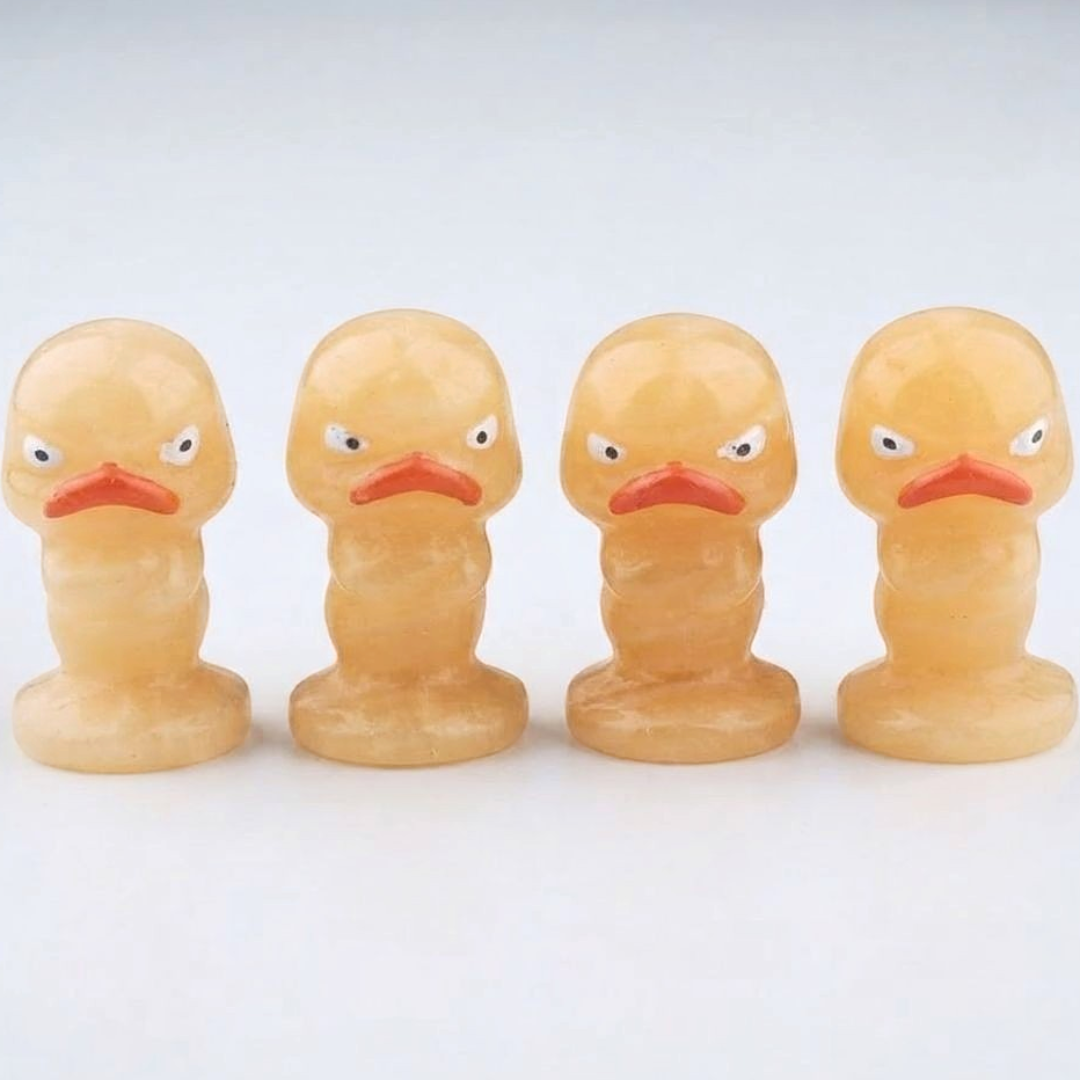 Orange Calcite Carved Grumpy Duck Figurines Set of 4 — Polished Crystal Carving Collector Display Piece — shown with measuring tape for scale