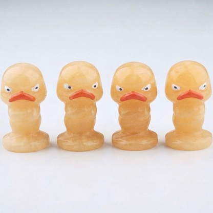 Orange Calcite Carved Grumpy Duck Figurines Set of 4 — Polished Crystal Carving Collector Display Piece — shown with measuring tape for scale