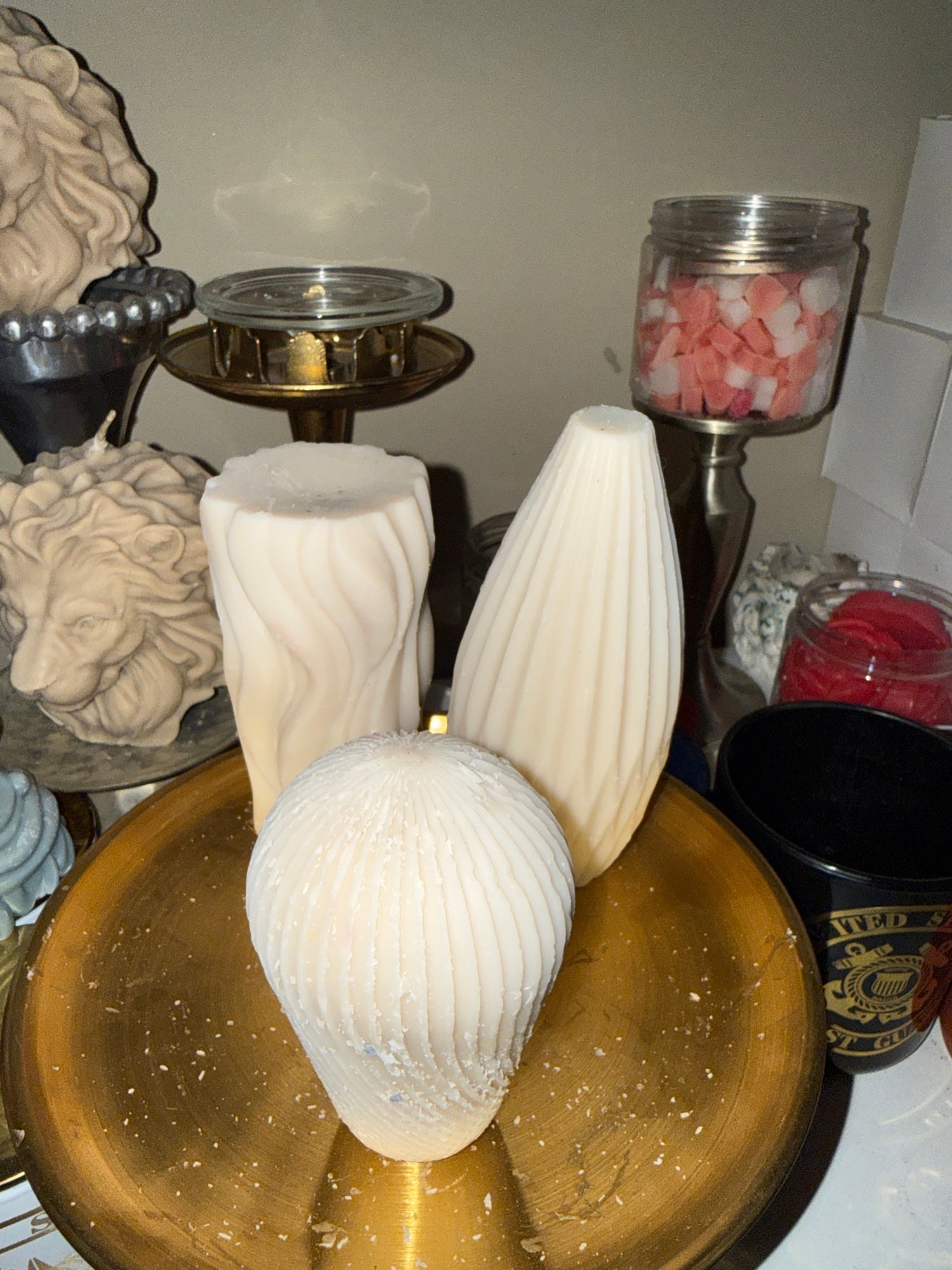 ENZ-GSP-WHT EnZebra white geometric swirl pillar candles — ribbed cylinder, teardrop vase, and egg trio on gold tray