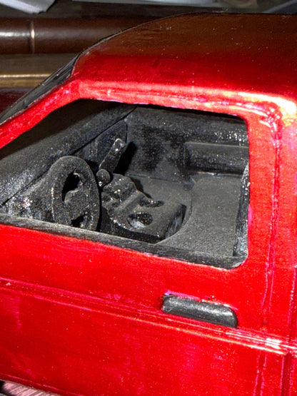 GWL-VEH-002 Dominator 1995 Nissan Pickup — cab interior detail, hand-carved steering wheel and dashboard