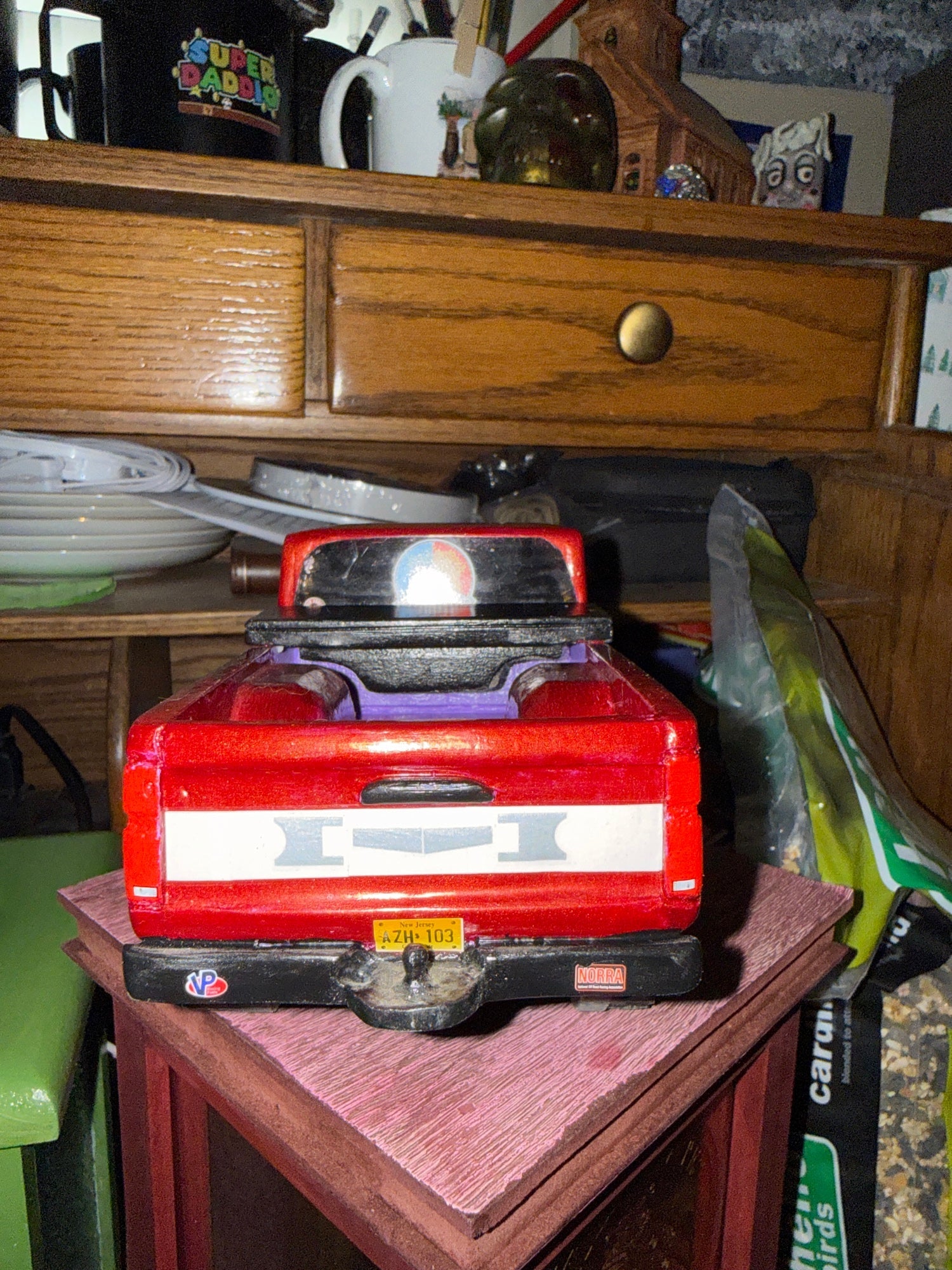 GWL-VEH-002 Dominator 1995 Nissan Pickup — rear view, custom tailgate, license plate AZH 103, hitch detail