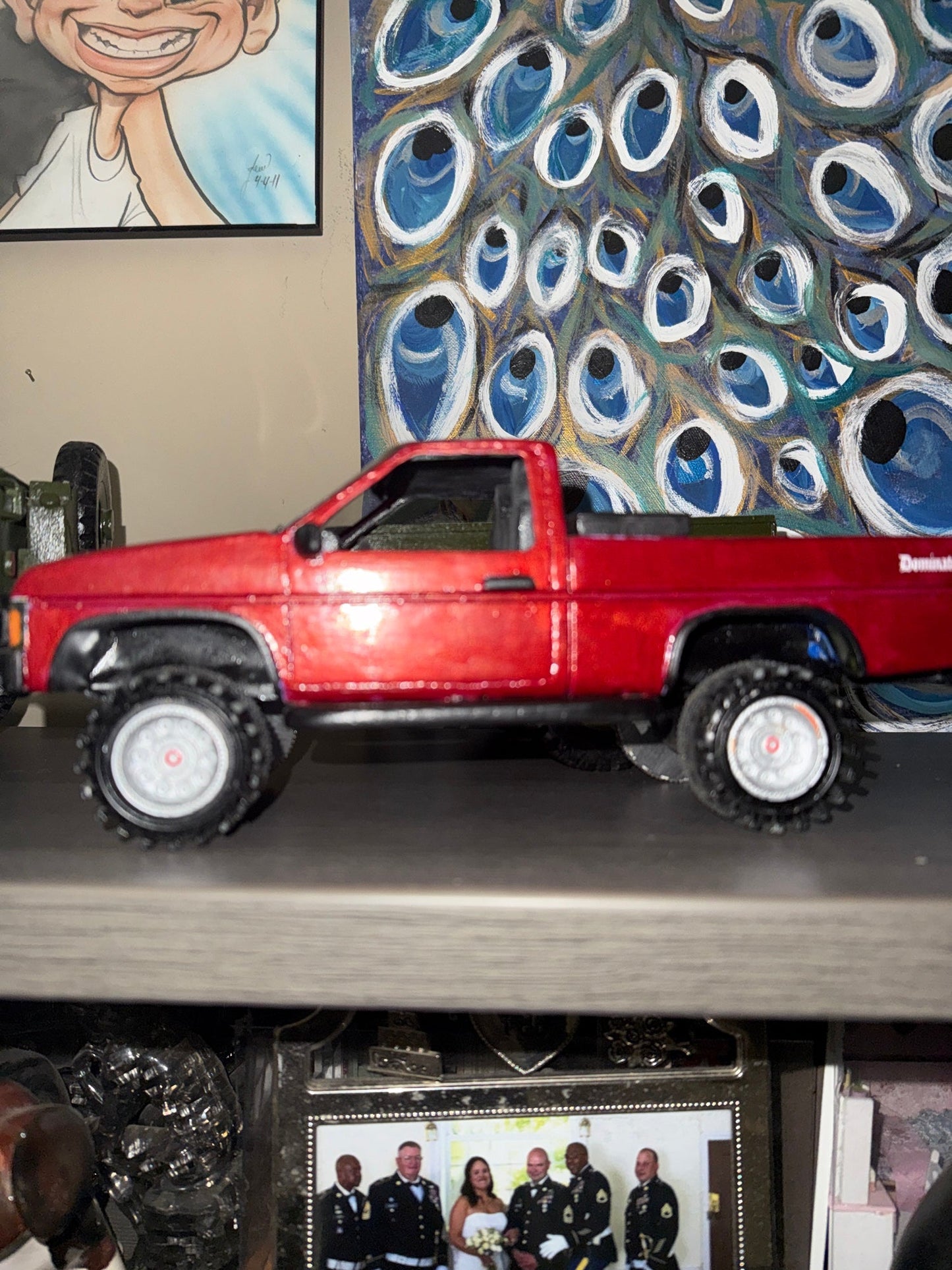 GWL-VEH-002 Dominator 1995 Nissan Pickup handmade wood — driver side profile, lifted stance, rubber off-road tires, Dominator badge