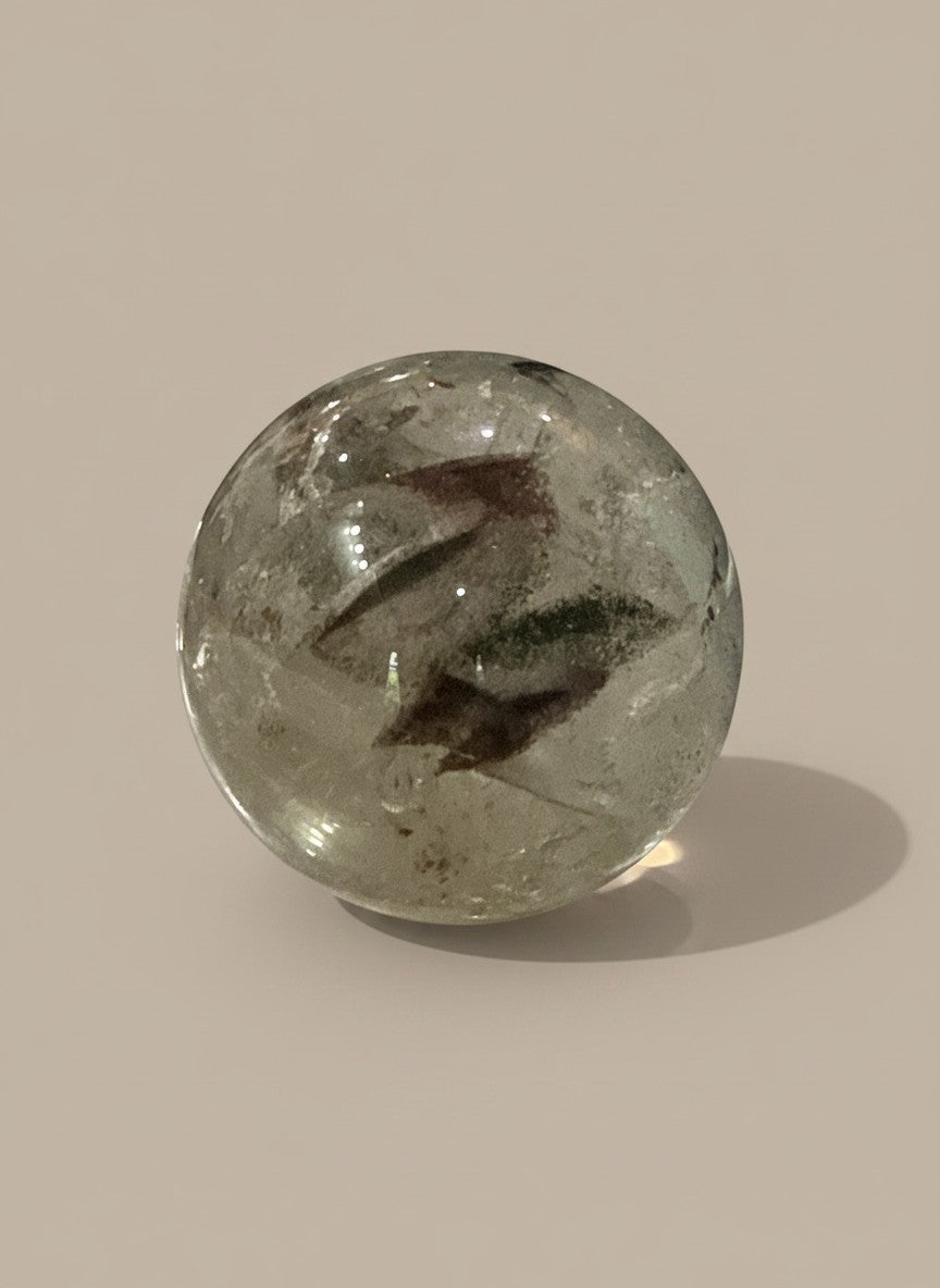 Zebra Industries, LLC polished garden quartz sphere with natural green and brown mineral inclusions in clear crystal