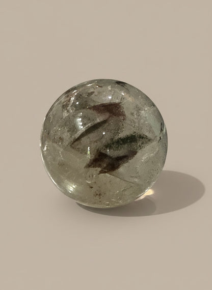 Zebra Industries, LLC polished garden quartz sphere with natural green and brown mineral inclusions in clear crystal