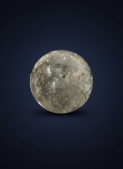 Zebra Industries, LLC polished garden quartz sphere with natural mineral inclusions and clear crystal finish.