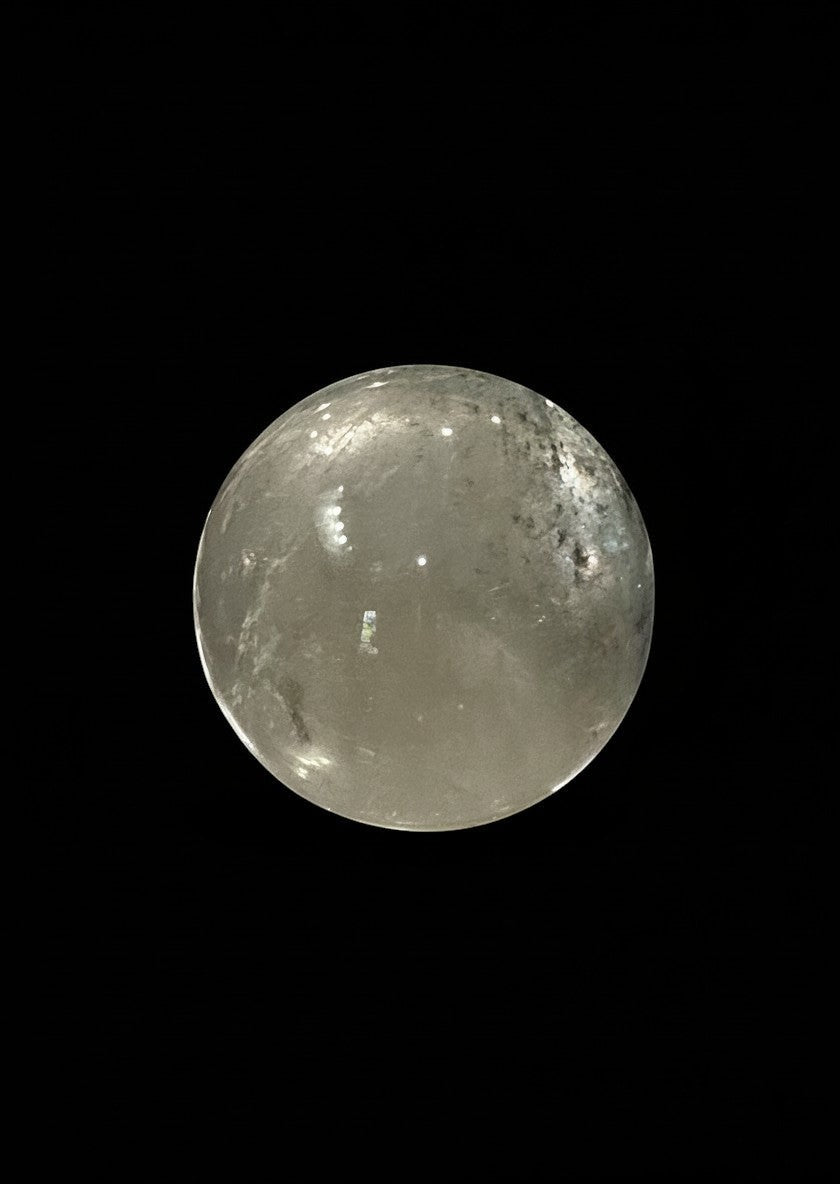 Zebra Industries, LLC collector grade garden quartz crystal sphere with natural inclusions on a black background