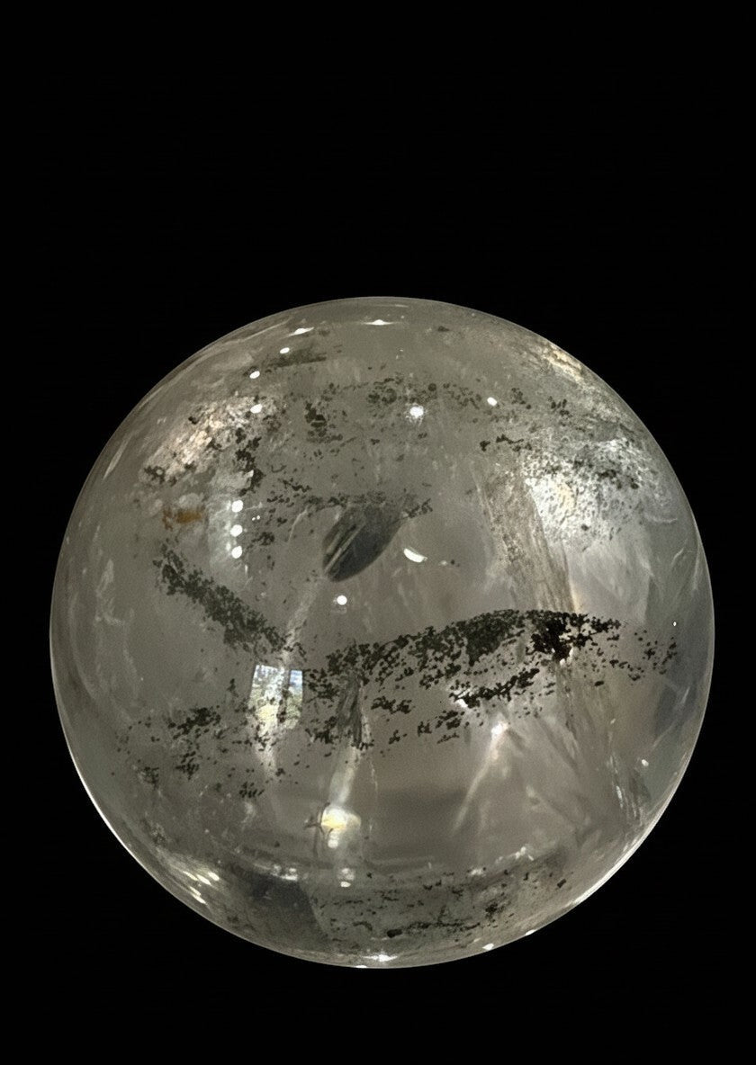 Zebra Industries, LLC collector grade garden quartz crystal sphere with clear inclusions on a black background