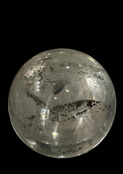 Zebra Industries, LLC collector grade garden quartz crystal sphere with clear inclusions on a black background