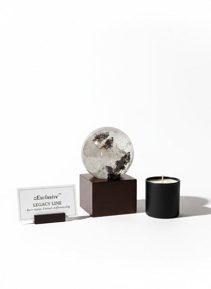 Zebra Industries, LLC collector-grade garden quartz sphere on a wooden stand with a candle and brand display card.