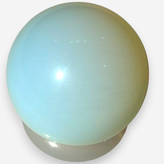 Zebra Industries, LLC polished opalite sphere with a milky aqua-blue glass finish and subtle adularescent glow.