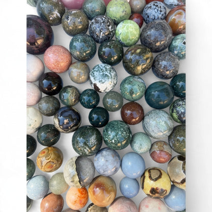 Zebra Industries, LLC assorted polished natural stone spheres in various colors, textures, and mineral patterns.