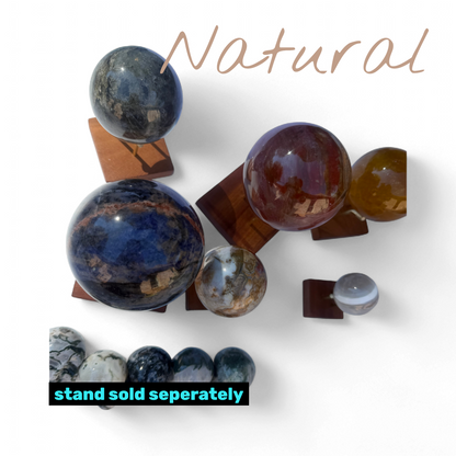 Zebra Industries, LLC assorted polished natural stone spheres in various sizes, colors, and mineral patterns.