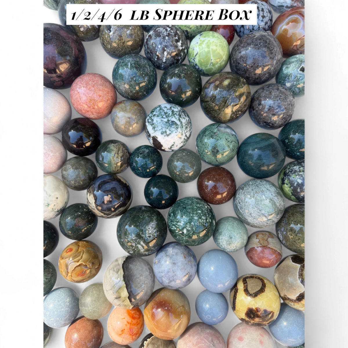 Zebra Industries, LLC assorted polished natural stone spheres in various colors and patterns for crystal collections.