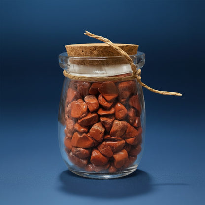Zebra Industries, LLC glass jar filled with polished red jasper tumbled crystal chips and a natural cork stopper.