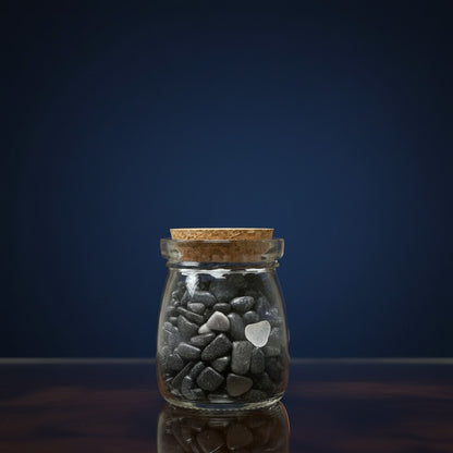 Zebra Industries, LLC corked glass jar filled with smooth tumbled black tourmaline and clear quartz crystal chips.